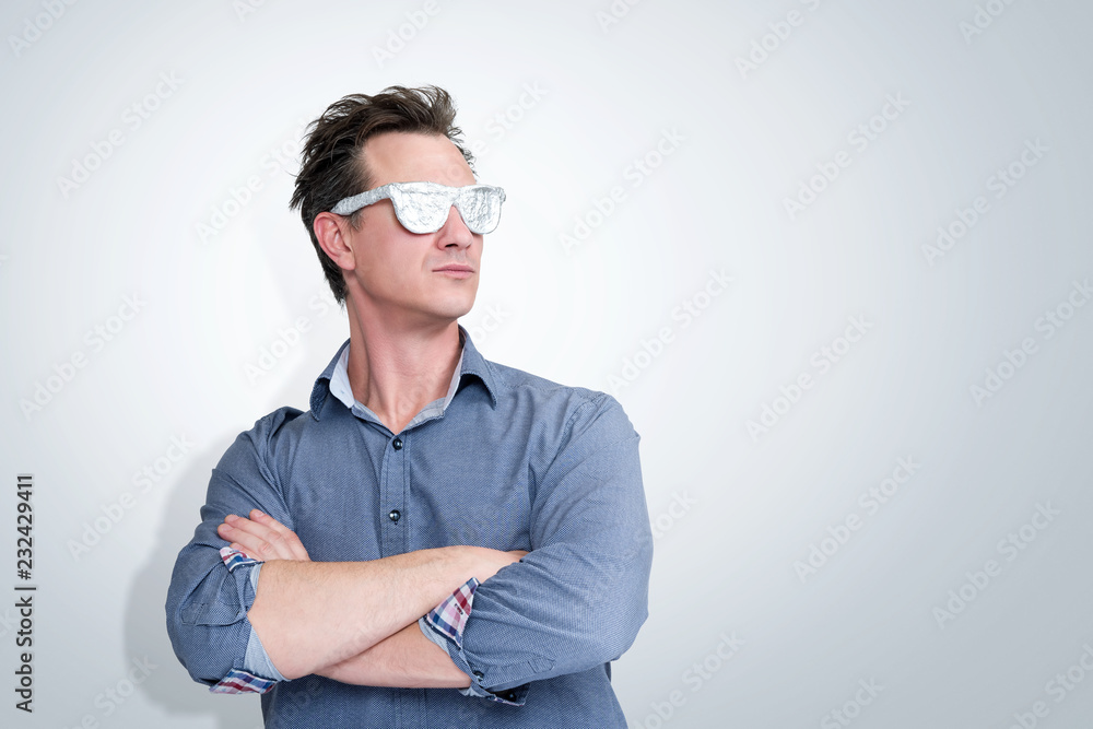 Confident man in shirt and aluminum glasses, visionary concept Confident man in shirt and aluminum glasses, visionary concept
