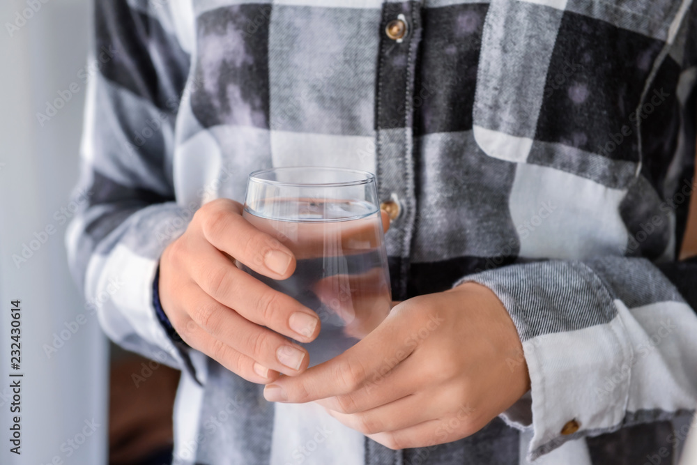 Woman holding glass of fresh water, closeup Woman holding glass of fresh water, closeup
