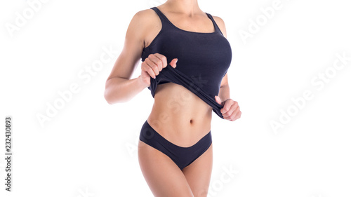 Sexy body of a beautiful woman. Beautiful woman body. Perfect shining skin for summer. Slim tanned woman's body. Isolated over white background. Beautiful sexy female slim tanned body