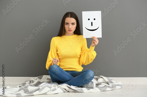 Emotional woman holding she...