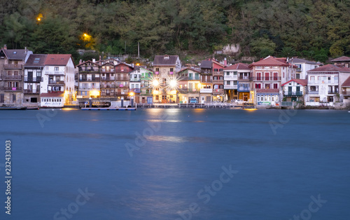 Lights at dusk in the old town by the sea of Pasai Donibane © poliki