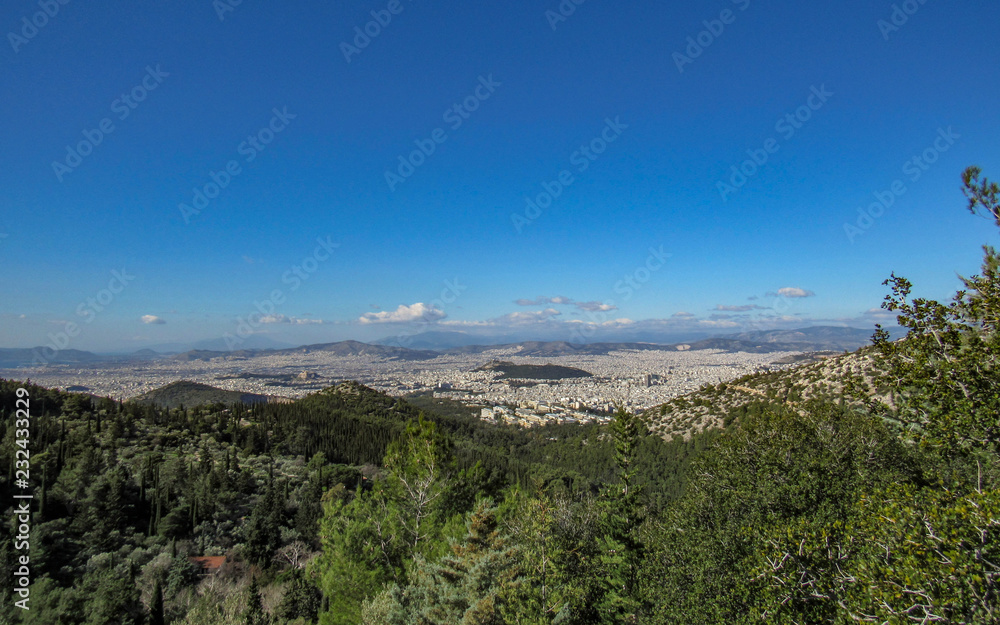 Cityscape of Athens in sunny day with the Acropolis seen from above, Greece