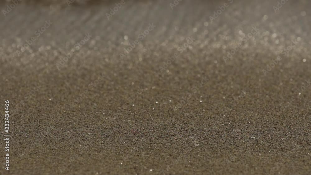 Waves on sand on the shore line, extreme close up, slow motion - part 1 Waves on sand on the shore line, extreme close up, slow motion - part 1