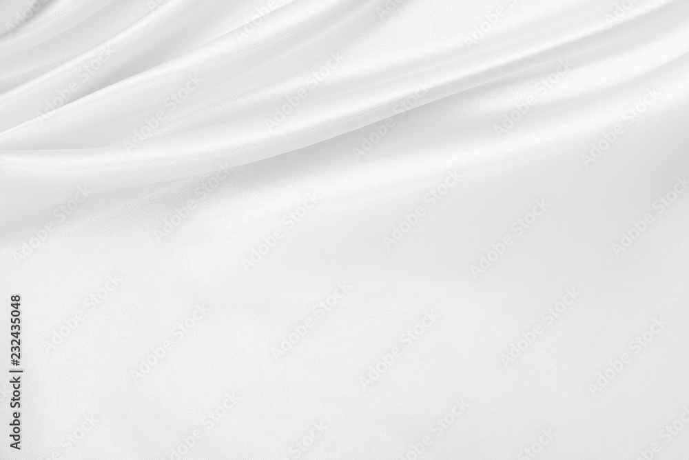 Smooth elegant white silk or satin luxury cloth texture as wedding background. Luxurious background design Smooth elegant white silk or satin luxury cloth texture as wedding background. Luxurious background design