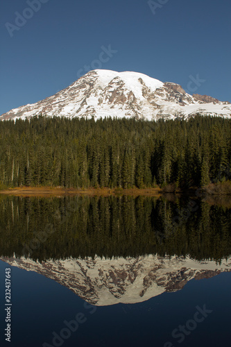 Mount Rainier with its reflection in Reflection Lakes. Minimalist nature background.