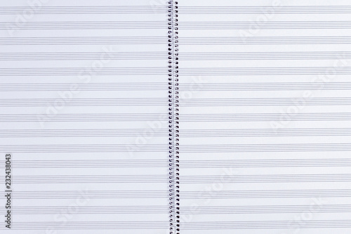 Empty exercise book with musical notes staff