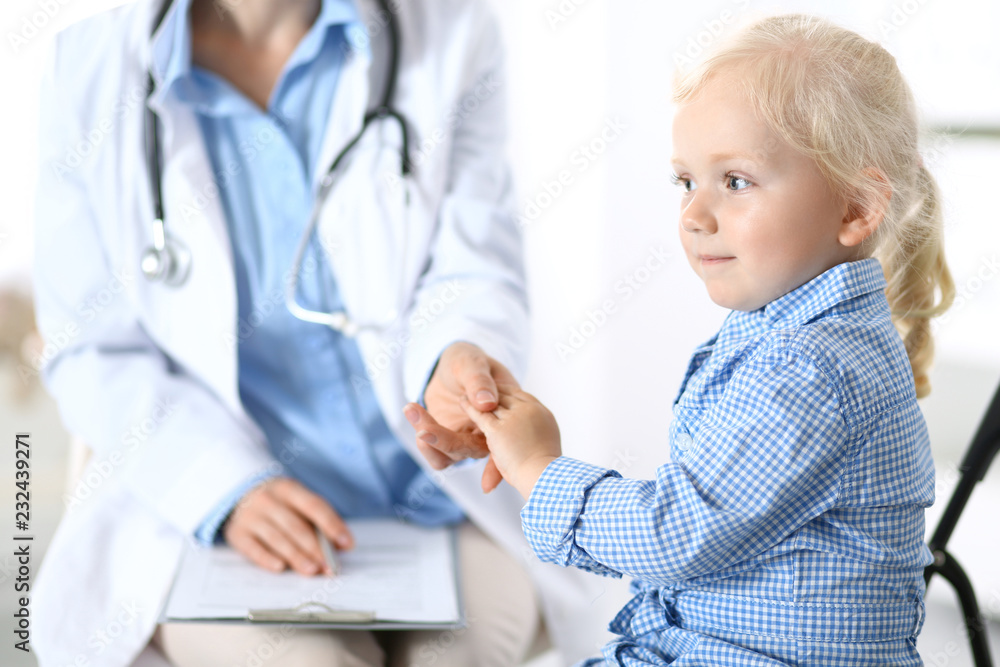 Doctor and a little blonde girl. Medicine and healthcare concept Doctor and a little blonde girl. Medicine and healthcare concept