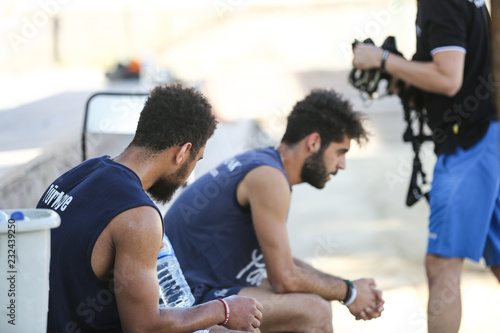 men training in the sand