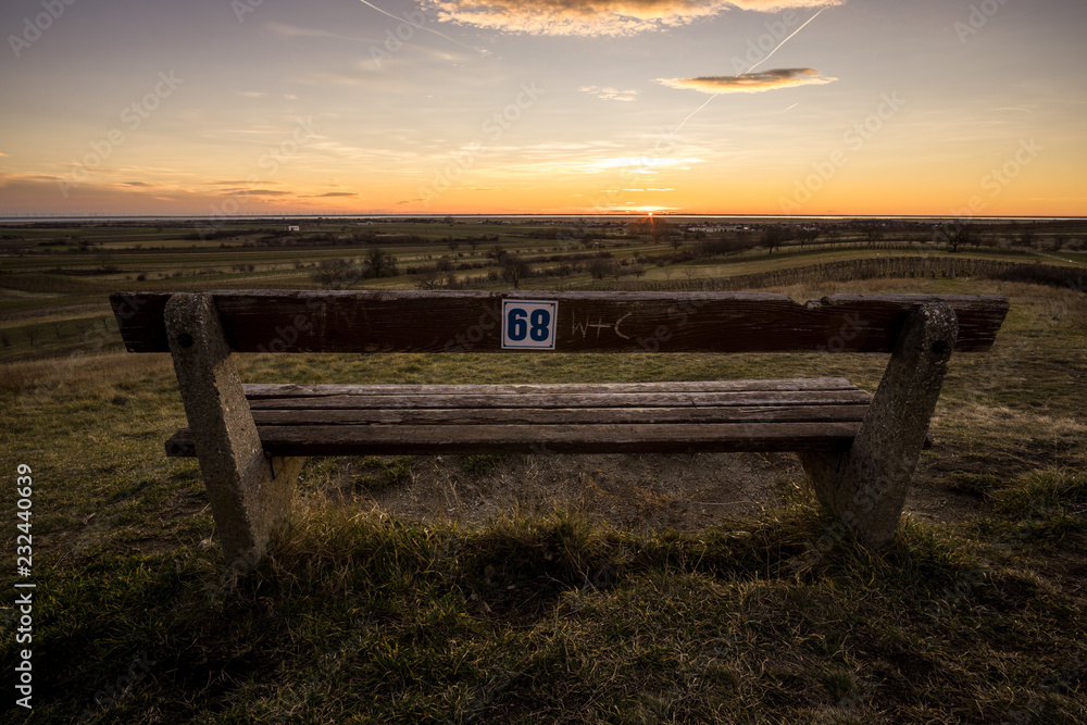 The first sunlight of the day brings warmth to this resting bench The first sunlight of the day brings warmth to this resting bench