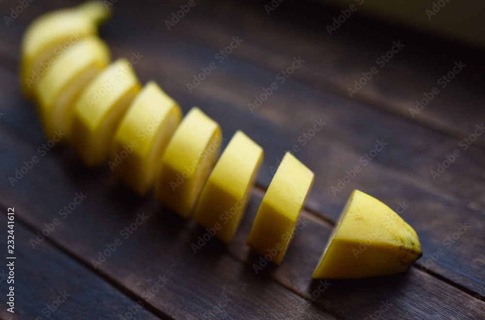 ripe bananas cut on a dark background ripe bananas cut on a dark background