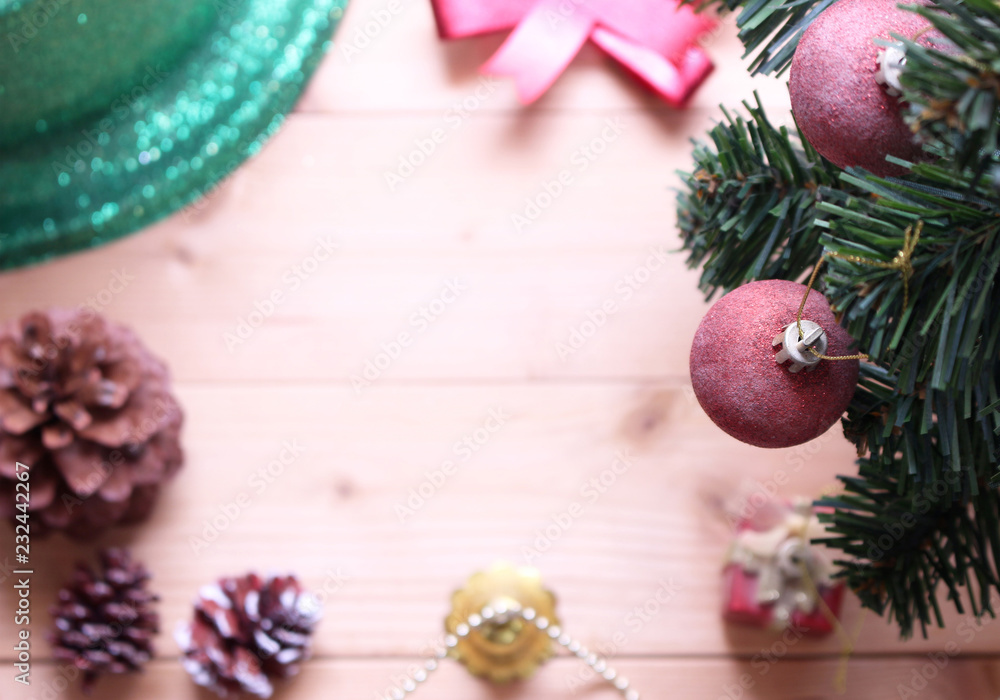 Christmas tree background with decorations on wooden board.selective focus at ball