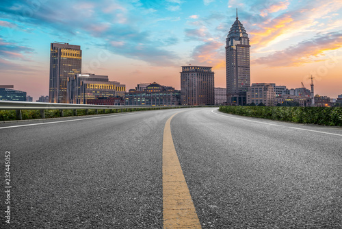 City skyscrapers and road asphalt pavement