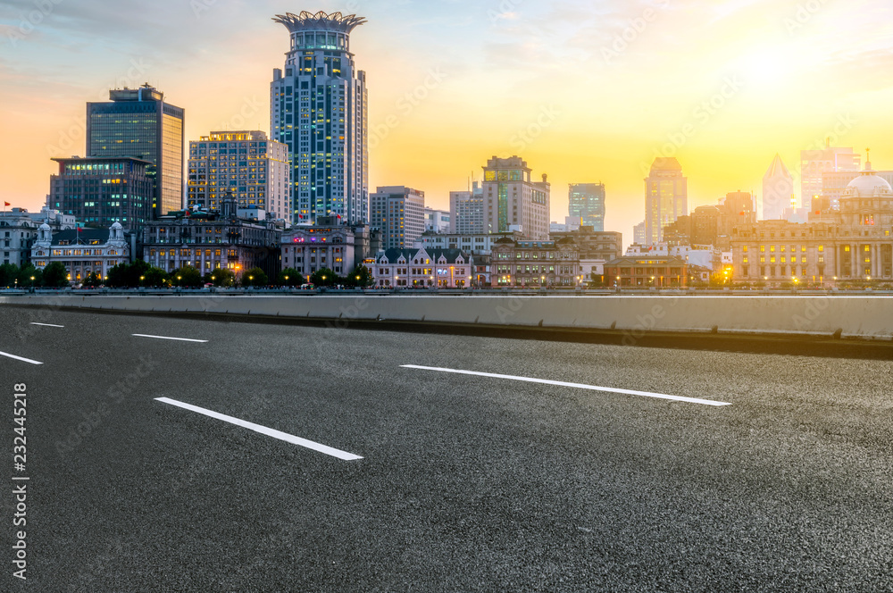 City skyscrapers and road asphalt pavement City skyscrapers and road asphalt pavement