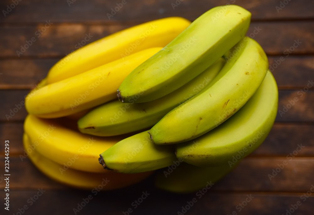 bunch of bananas on wooden boards