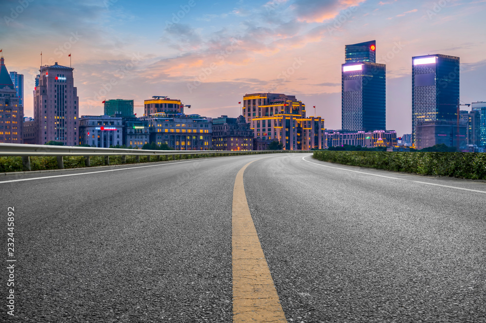 City skyscrapers and road asphalt pavement City skyscrapers and road asphalt pavement