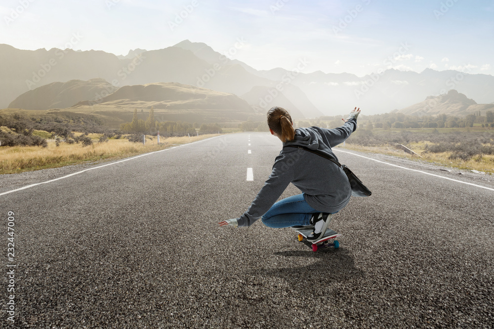 Teenager girl ride her skateboard. Mixed media Teenager girl ride her skateboard. Mixed media