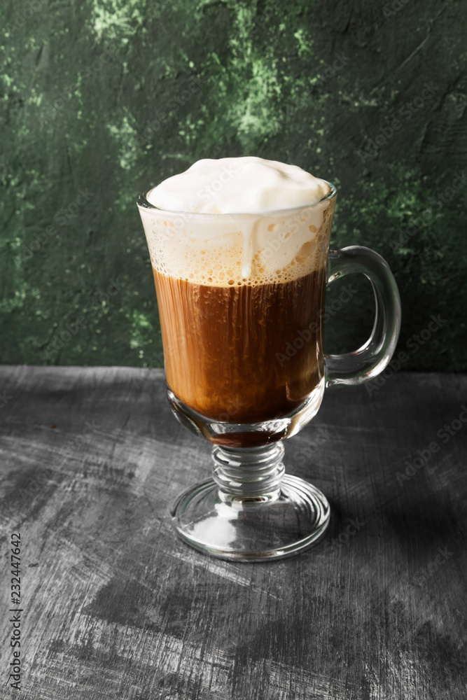 Irish coffee with whisky on dark background Irish coffee with whisky on dark background