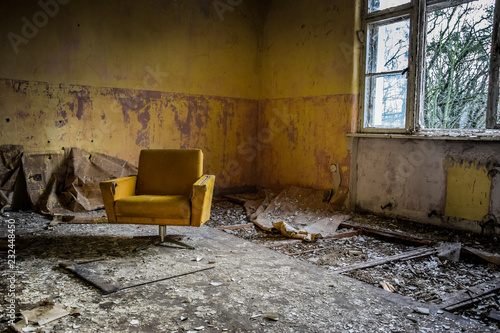 Vintage armchair in an abandoned room