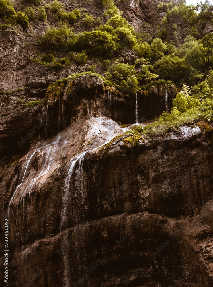 Fototapeta premium Mountain waterfall with green moss