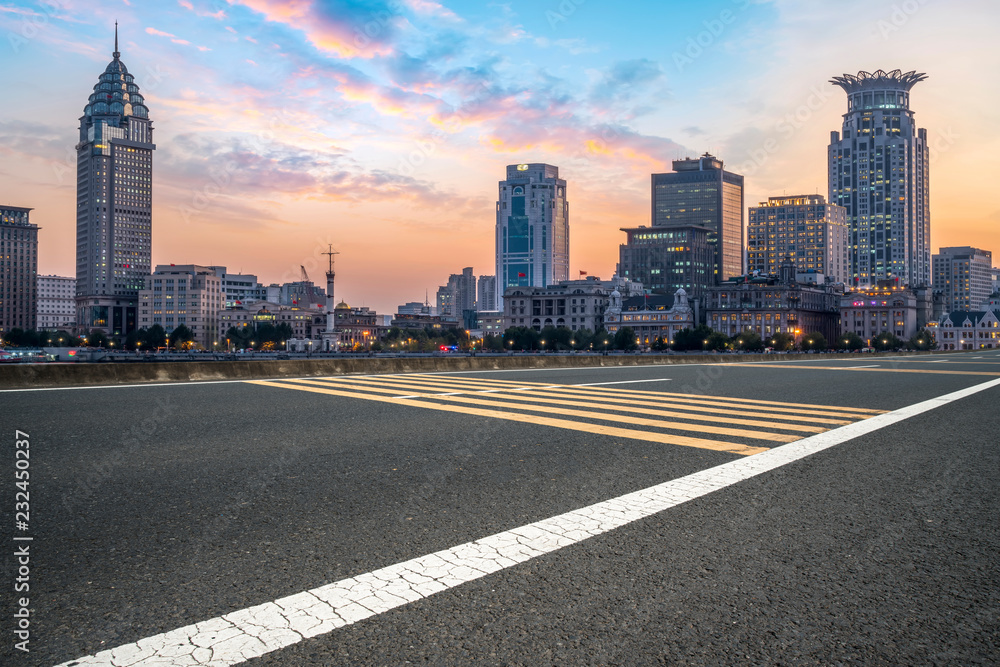 City skyscrapers and road asphalt pavement City skyscrapers and road asphalt pavement