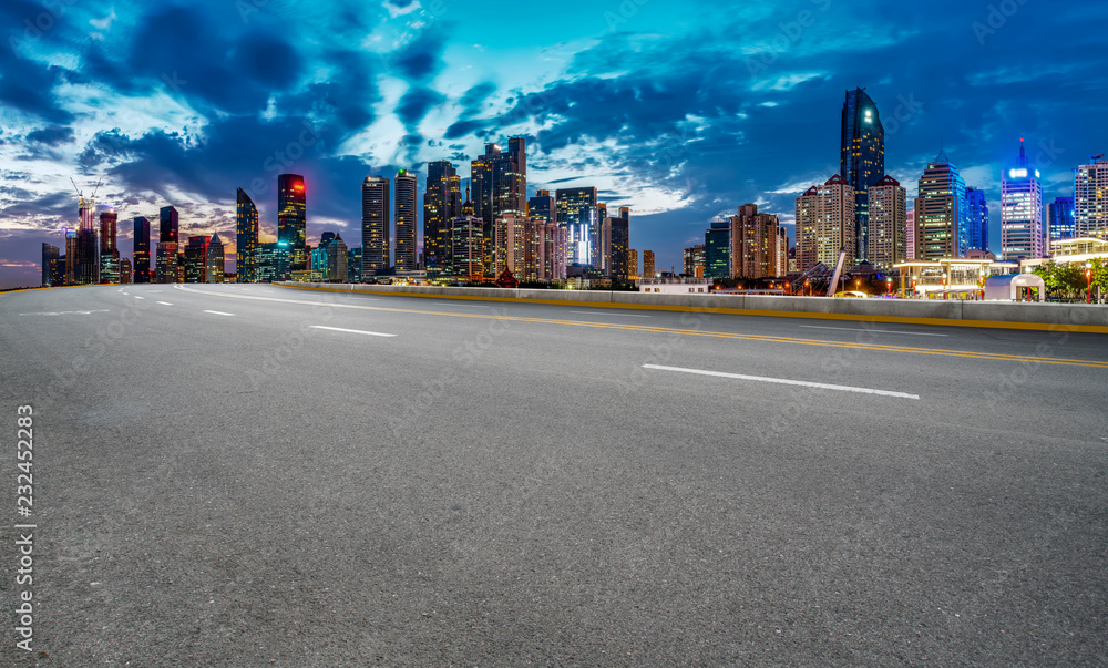 City skyscrapers and road asphalt pavement City skyscrapers and road asphalt pavement