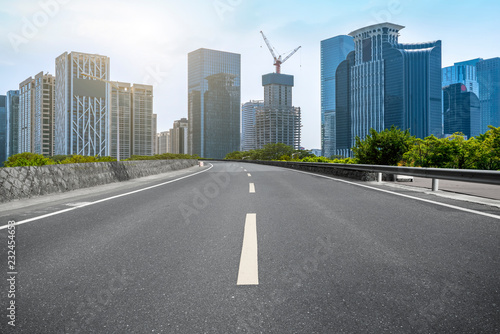 City skyscrapers and road asphalt pavement