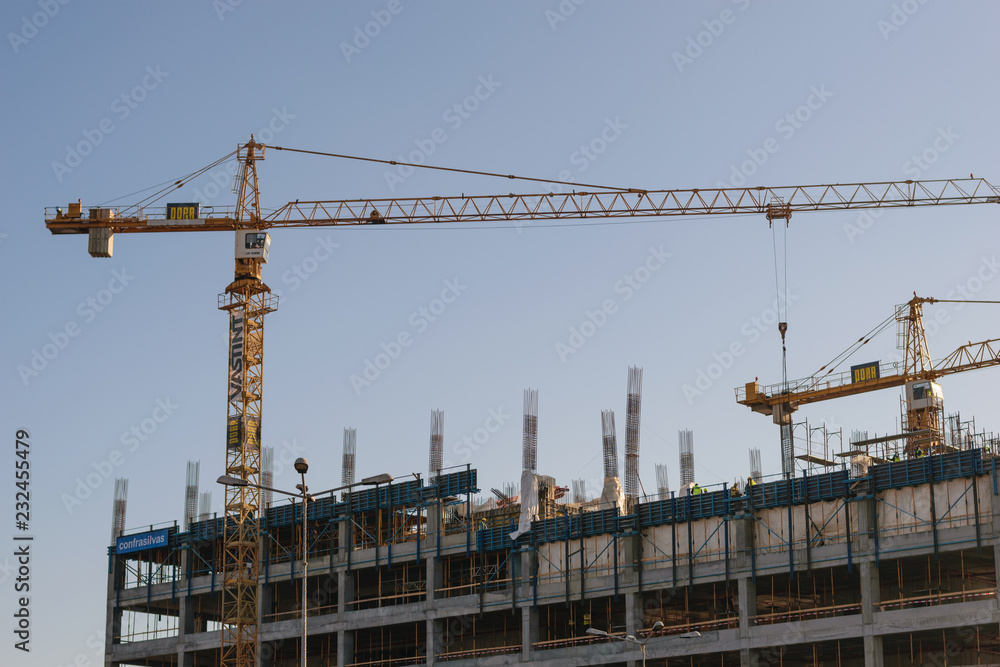Bucharest, Romania - January 25, 2018: Big yellow cranes construction building in Orhideea area of Bucharest.