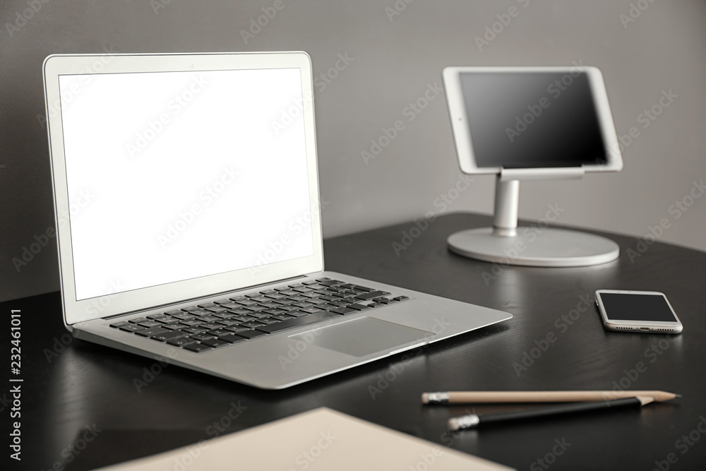 Comfortable workplace with laptop on table Comfortable workplace with laptop on table