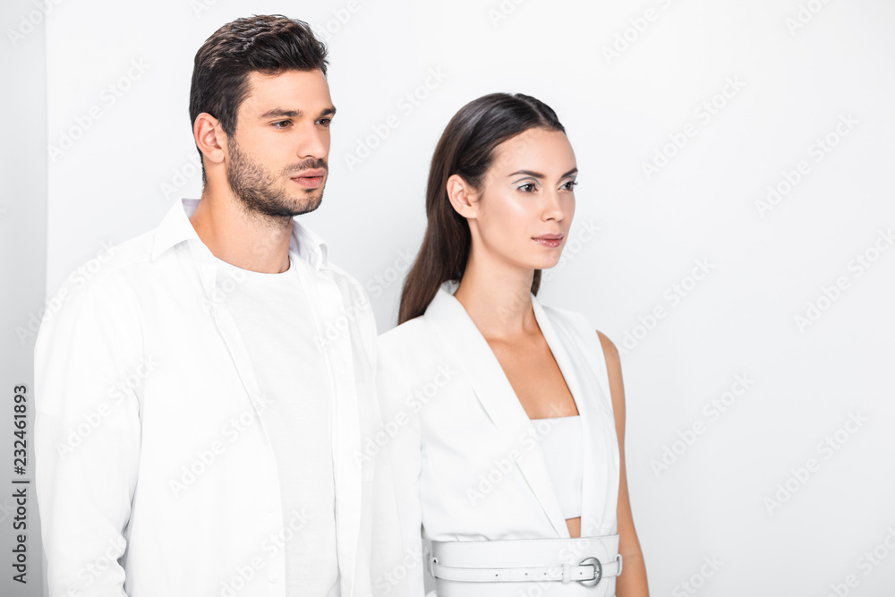 adult stylish couple in total white posing together adult stylish couple in total white posing together