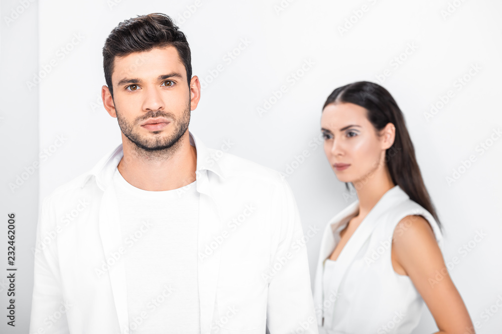 close up of adult stylish couple in total white close up of adult stylish couple in total white
