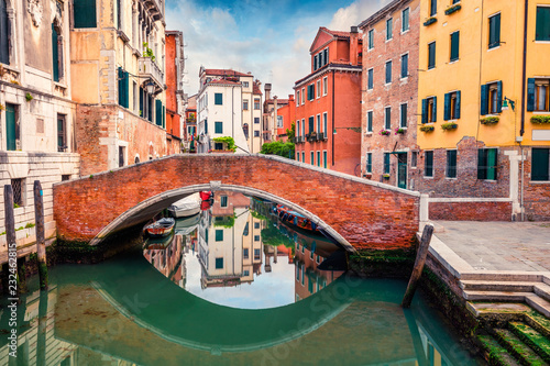 Bright spring view of Vennice with famous water canal and colorful houses. Splendid morning scene in Italy  Europe. Magnificent Mediterranean cityscape. Traveling concept background.