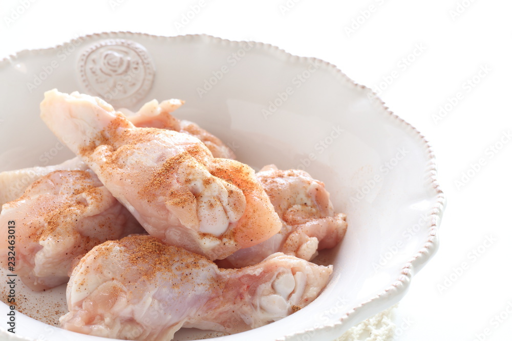 Cumin powder and chicken drumsticks for cooking image Cumin powder and chicken drumsticks for cooking image