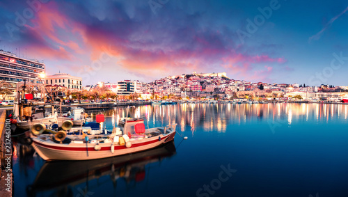 Fototapeta Naklejka Na Ścianę i Meble -  Great spring seascape on Aegean Sea. Coloful evening panorama of Kavala city, the principal seaport of eastern Macedonia and the capital of Kavala regional unit. Greece, Europe.