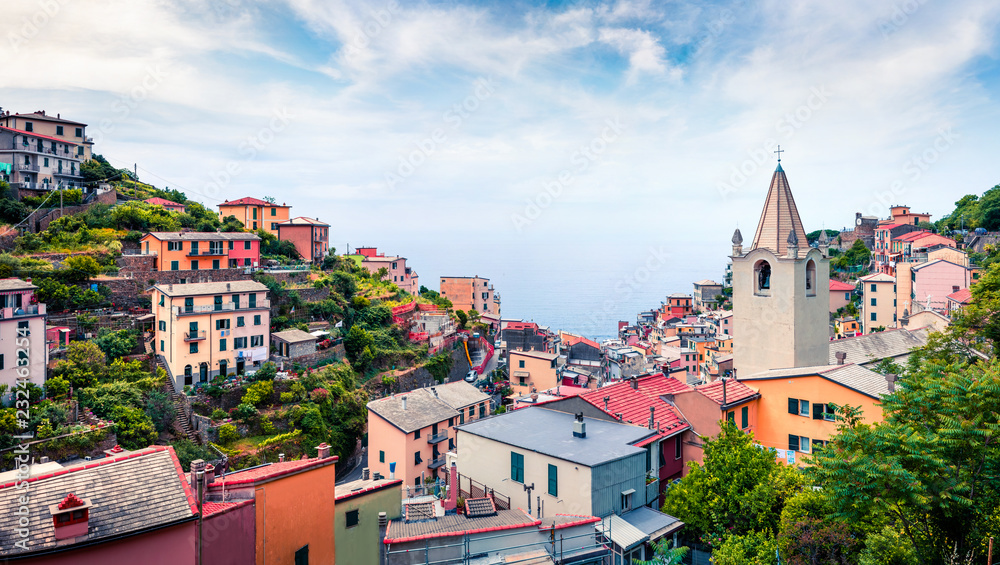 First city of the Cique Terre sequence of hill cities - Riomaggiore. Picturesque spring scene in Liguria, Italy, Europe. Traveling concept background.