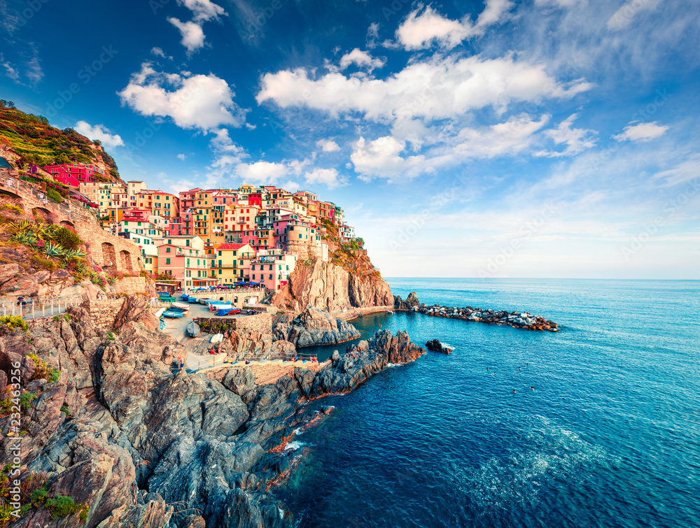 Second city of the Cique Terre sequence of hill cities - Manarola. Colorful spring morning in Liguria, Italy, Europe. Picturesqie seascape of Mediterranean sea. Traveling concept background.