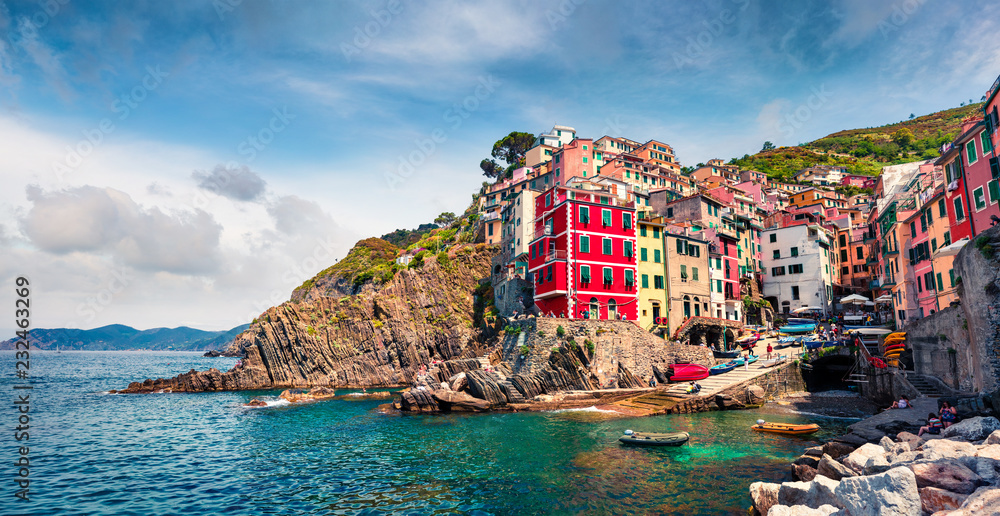 First city of the Cique Terre sequence of hill cities - Riomaggiore. Colorful morning view of Liguria, Italy, Europe. Great spring seascape of Mediterranean sea. Traveling concept background.