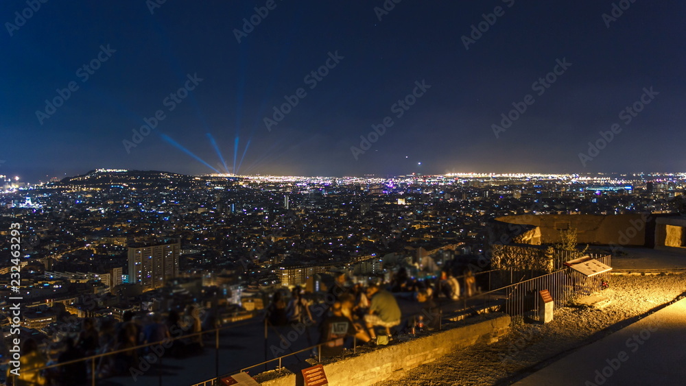 Fototapeta premium View of Barcelona timelapse, the Mediterranean sea, montjuic mountain from Bunkers Carmel. Catalonia, Spain.