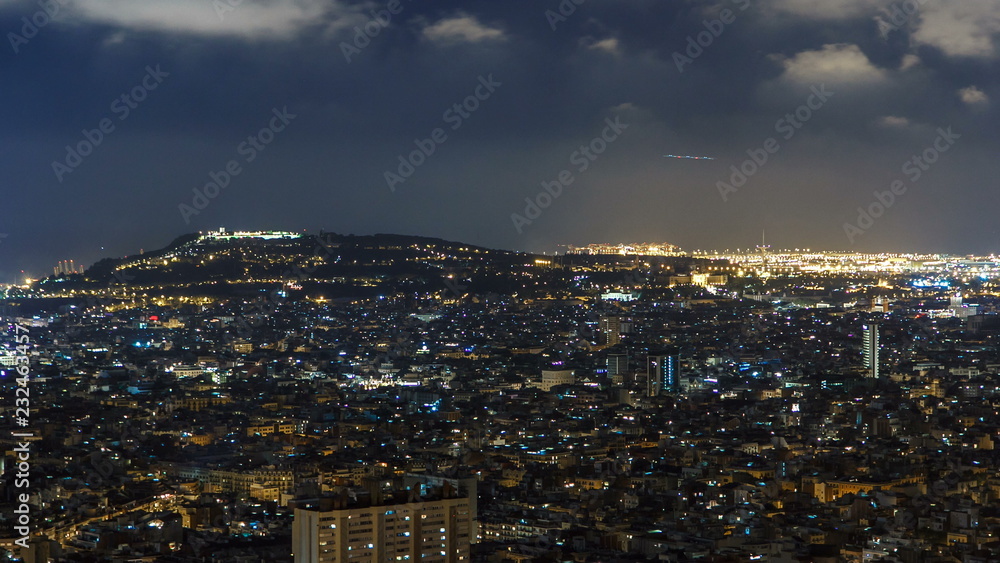 View of Barcelona timelapse, the Mediterranean sea, montjuic mountain from Bunkers Carmel. Catalonia, Spain.