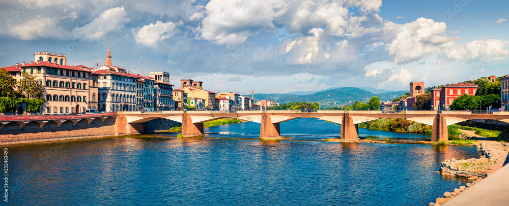 Picturesque morning scene with Ponte alle Grazie bridge over Arno river. Colorful spring view of Florence, Italy, Europe. Traveling concept background.
