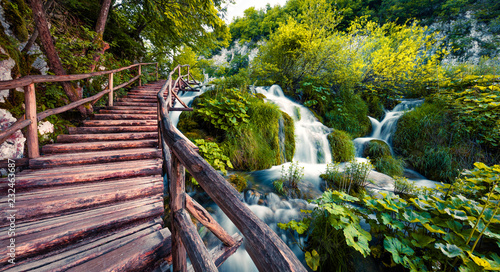 Fantastic morning view of Plitvice National Park. Colorful spring scene of green forest with pure water waterfall. Beautiful countryside landscape of Croatia, Europe. Traveling concept background. photo