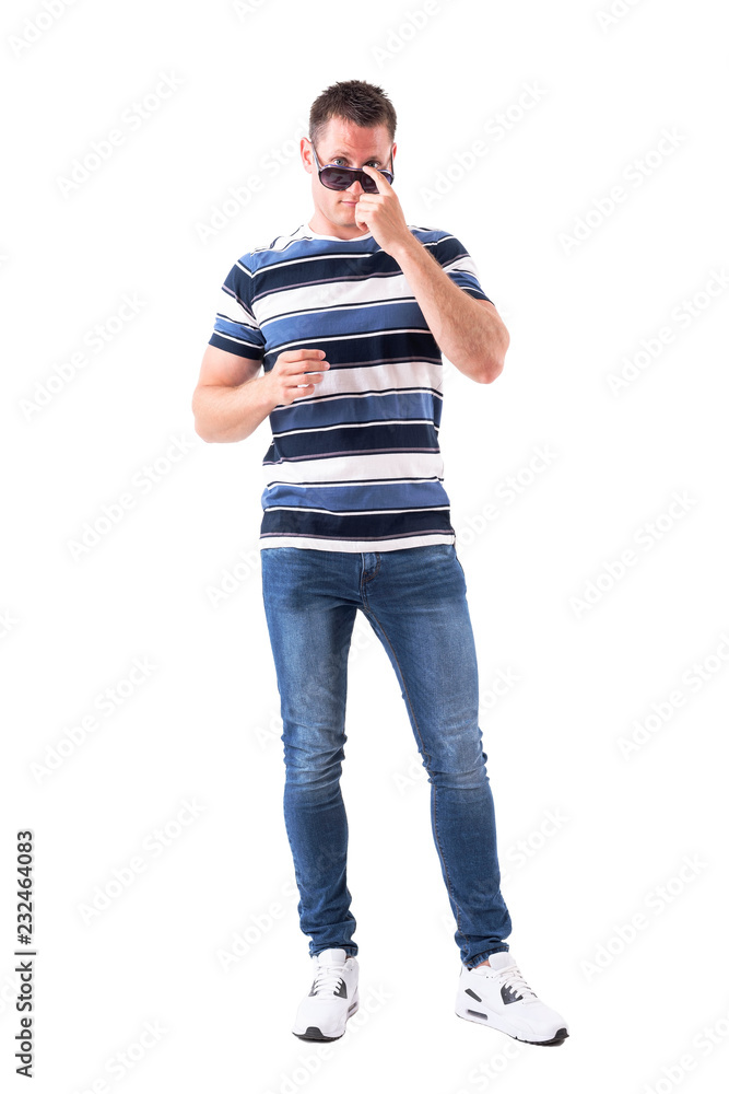 Cool handsome adult man adjusting sunglasses with finger push. Full body isolated on white background. Cool handsome adult man adjusting sunglasses with finger push. Full body isolated on white background.