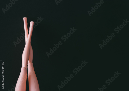 Girl legs against dark backround. Shopping concept. Minimal Black Friday sale.