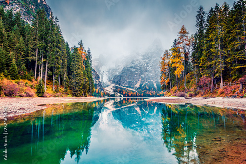 First snow on Braies Lake. Colorful autumn landscape in Italian Alps, Naturpark Fanes-Sennes-Prags, Dolomite, Italy, Europe. Beauty of nature concept background.