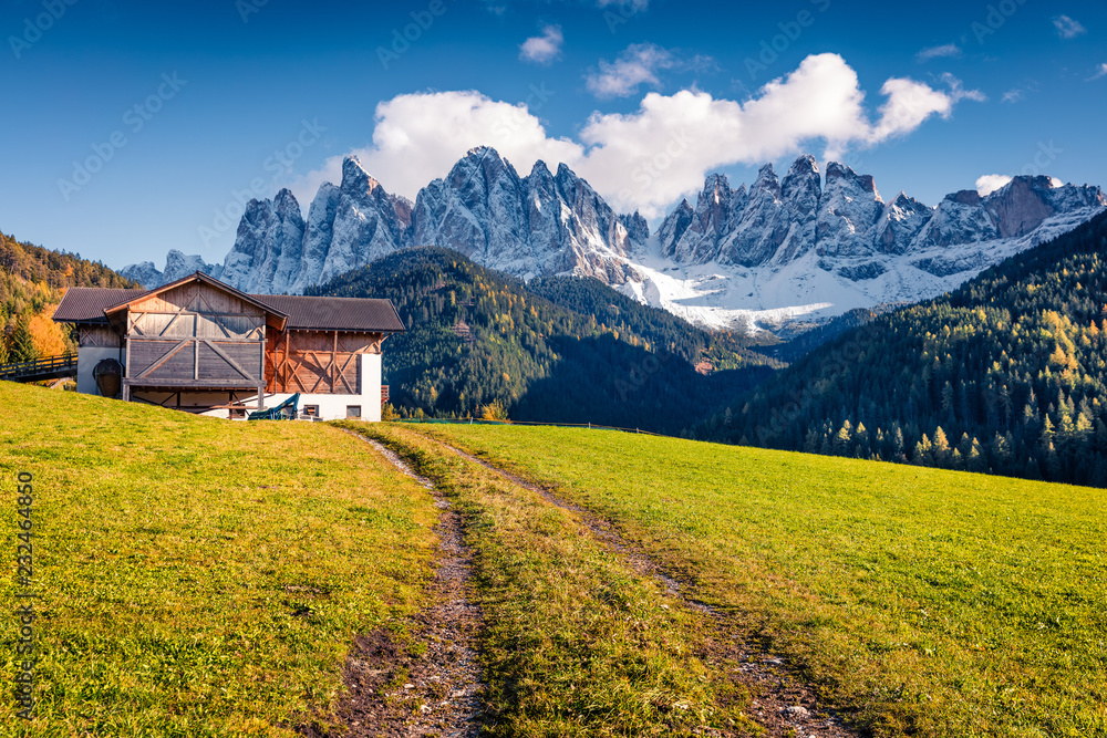 Splendid view of Santa Maddalena village in front of the Geisler or Odle Dolomites Group. Colorful autumn scene of Dolomite Alps, Italy, Europe. Traveling concept background.