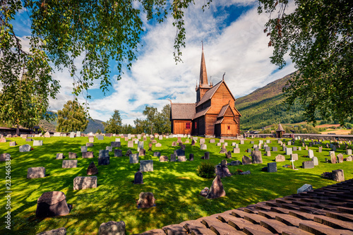 Picturesque summer view of Lom stave church (Lom Stavkyrkje). Sunny morning scene of Norwegian countryside, administrative centre of Lom municipality - Fossbergom, Norway, Europe. photo