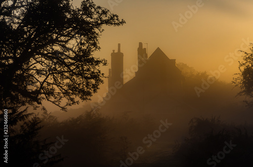 Silhouette of house in mist