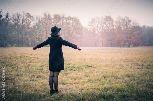 Free woman in foggy morning