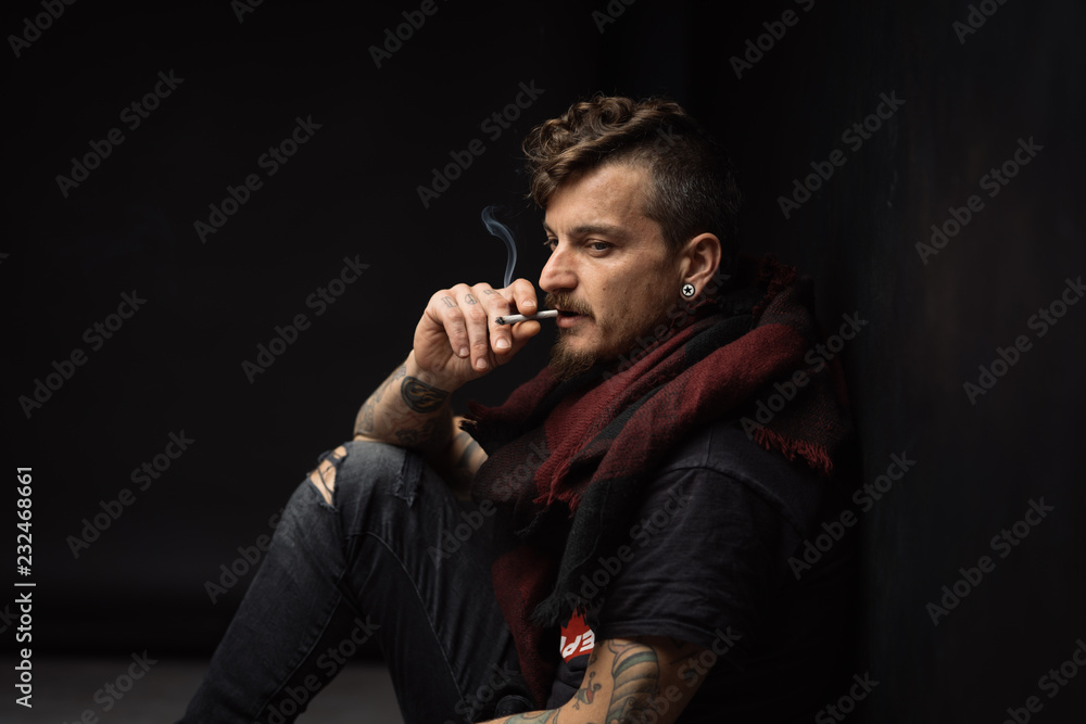 details of a man smoking a cigarette details of a man smoking a cigarette