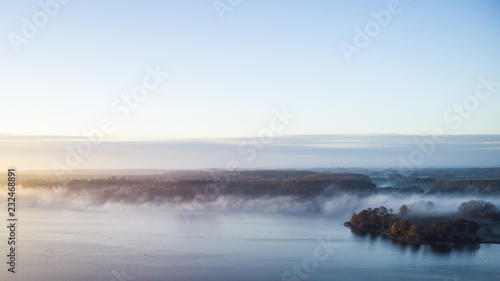 Morning mist on the banks of big lake