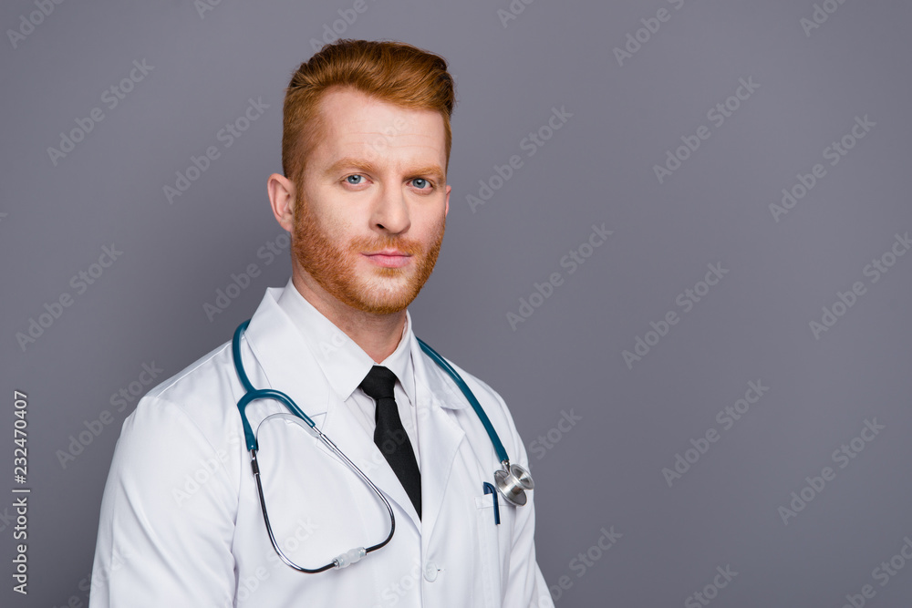 Half turn portrait of handsome attractive doctor isolated on dar Half turn portrait of handsome attractive doctor isolated on dar